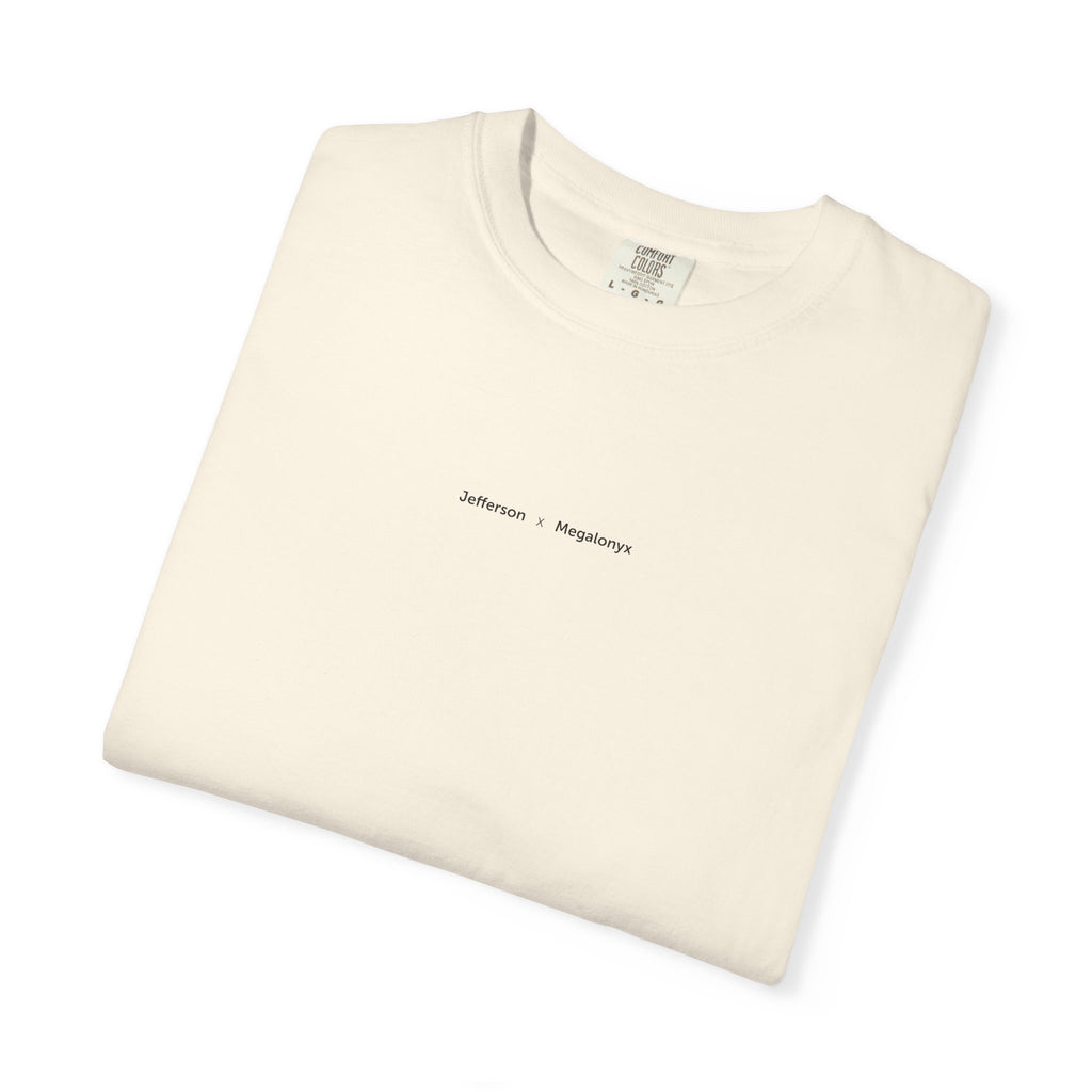 Ivory Course America tee, folded, showing the small Jefferson x Megalonyx chest lettering