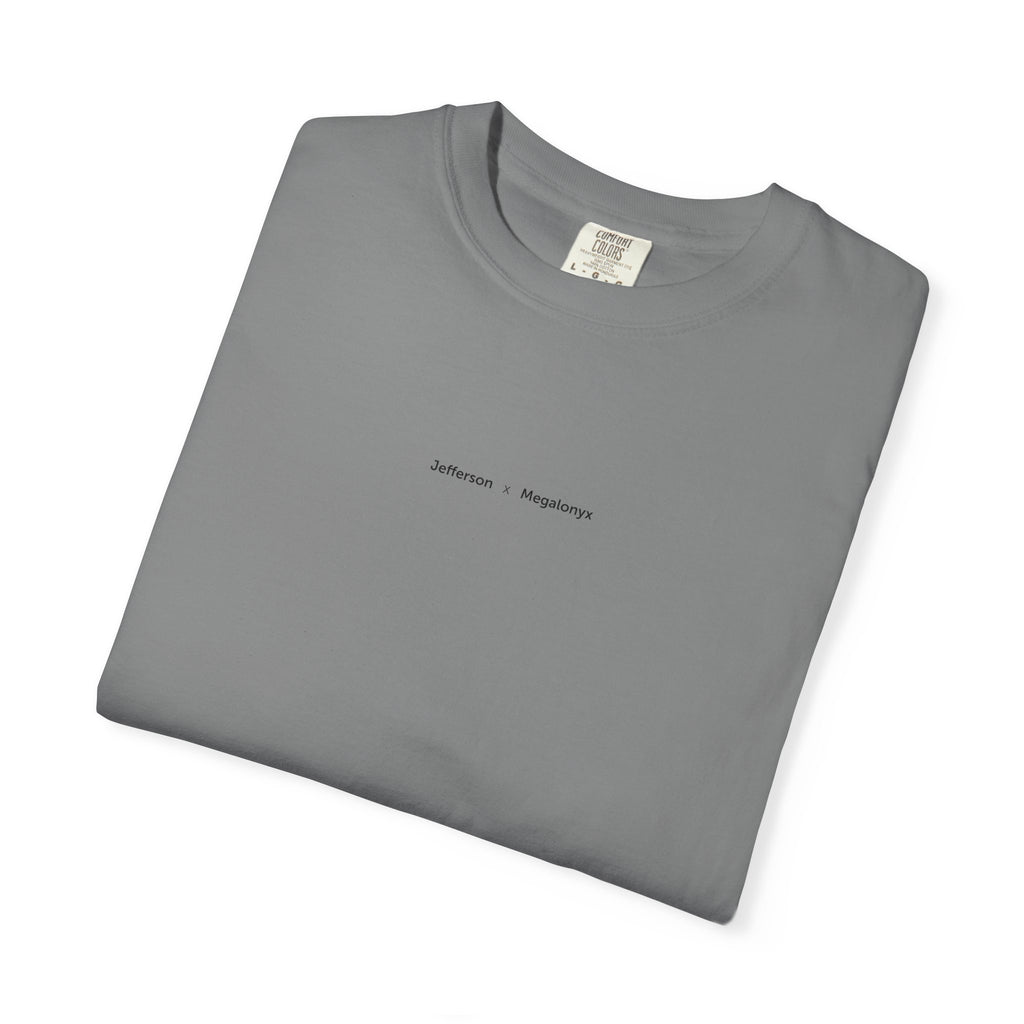 Grey Course America tee, folded, showing the small Jefferson x Megalonyx chest lettering