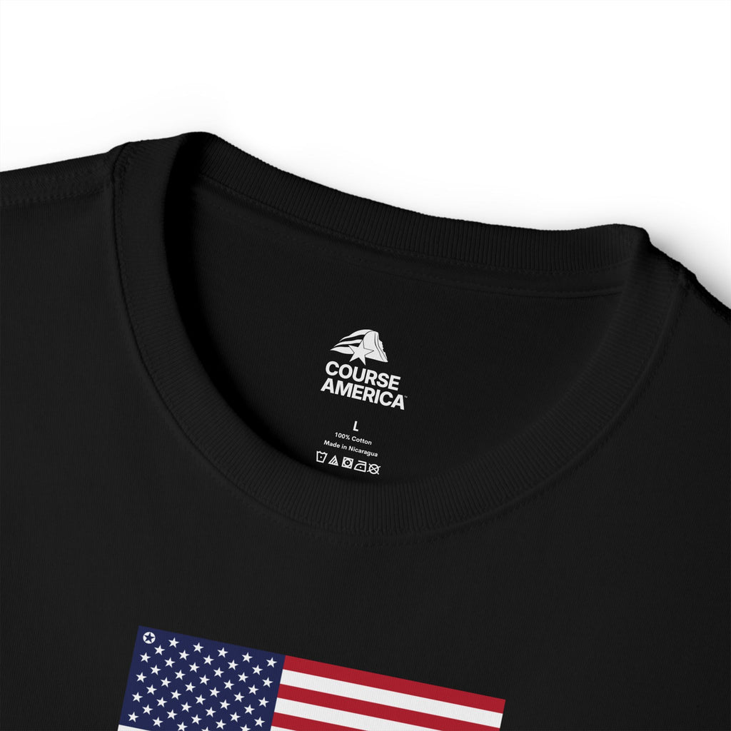 Black Course America tee, close up of the inner neck label beside an American flag