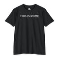 Black Course America tee, flat front view, printed THIS IS ROME in grey