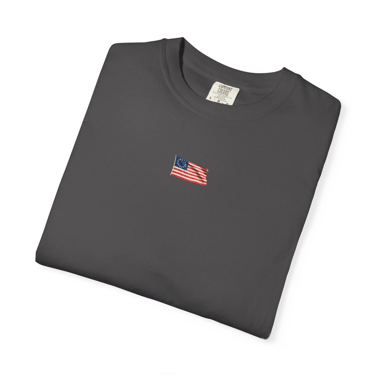 Graphite Course America tee, folded, showing the small American flag chest print