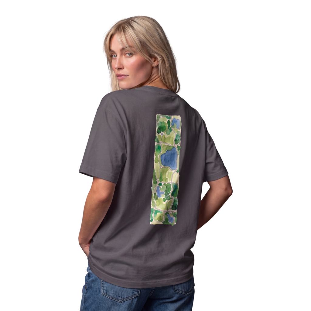 Woman seen from behind in the graphite Course America tee, the back print a watercolour map of Central Park