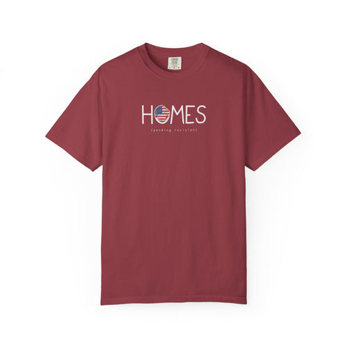 Chili red Course America tee, flat front view, printed HOMES in white with a flag filled O, above the words pending revision