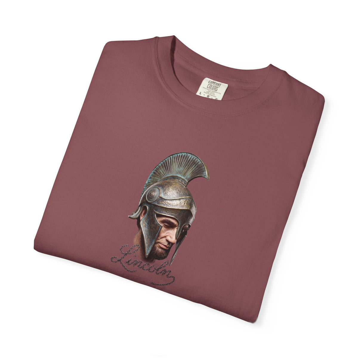 Brick red Course America tee, folded, showing Abraham Lincoln in a crested Greek helmet above the word Lincoln in script